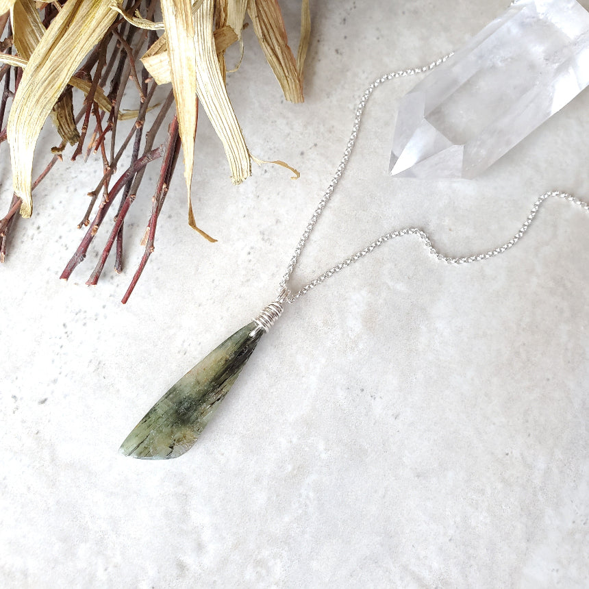 Green Kyanite freeform pendant necklace on tile