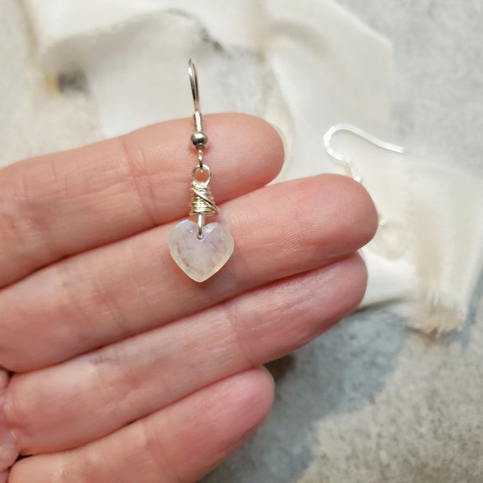 Moonstone heart earrings in hand