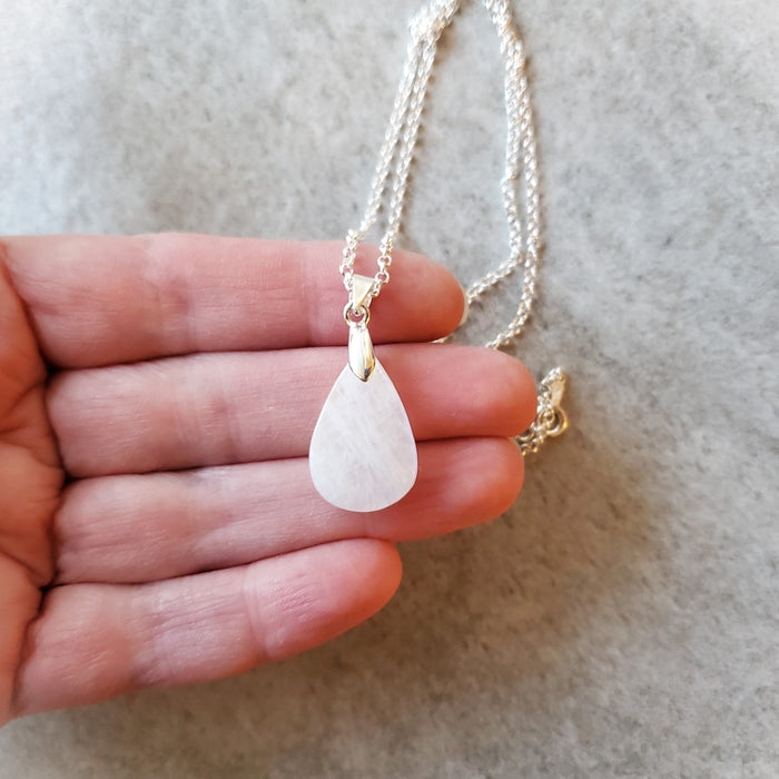 Moonstone pendant necklace in hand