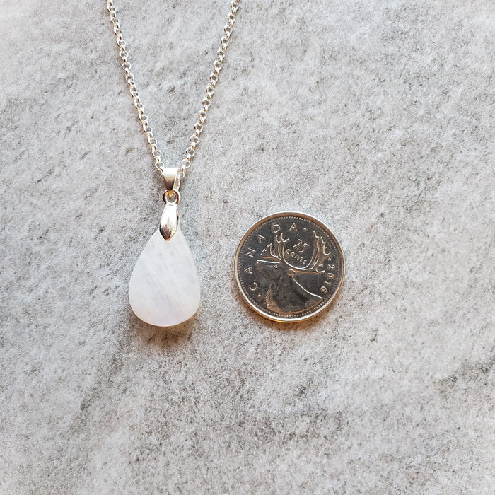 Moonstone pendant necklace in hand