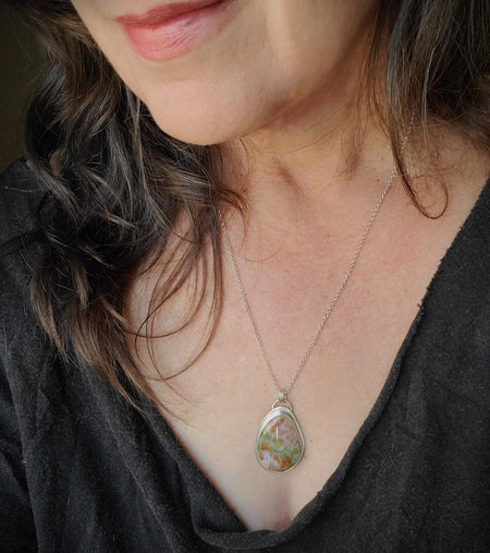 Ocean Jasper Freeform silversmith pendant on model