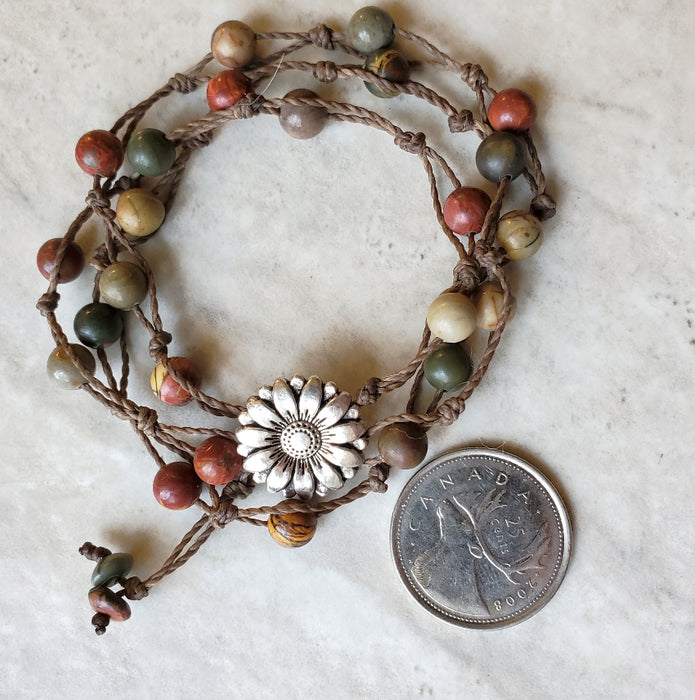 Picasso Jasper 3 wrap bracelet beside a quarter