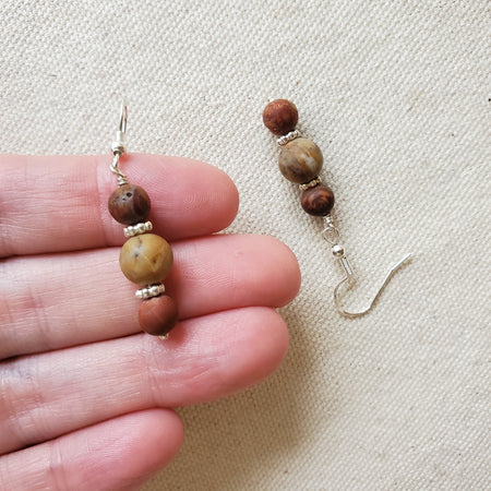 Picasso Jasper and crazy Lace Agate earrings in hand