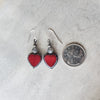 red Czech glass heart earrings with Labradorite beside a quarter