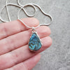 Blue Labradorite teardrop pendant necklace in hand