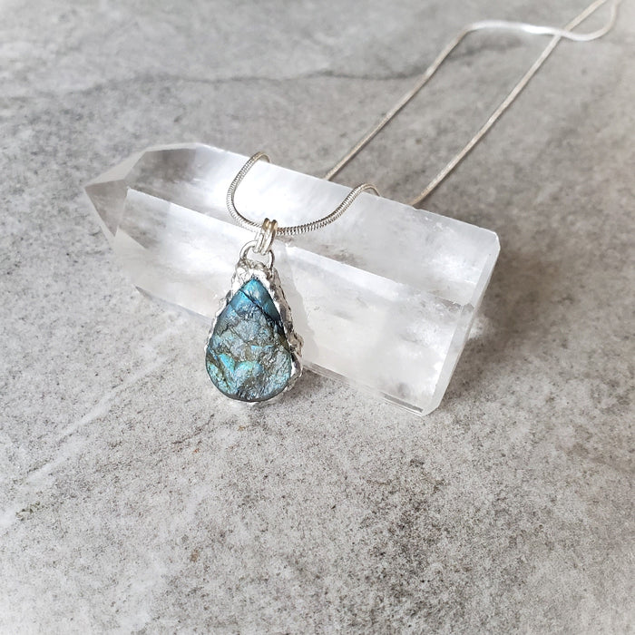 Blue Labradorite teardrop pendant necklace on crystal