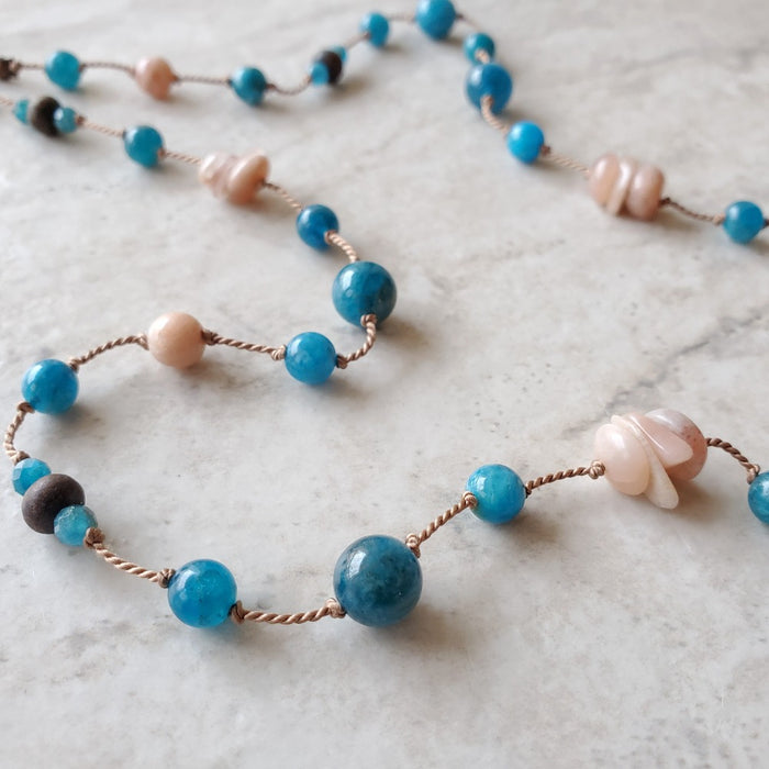 long silk  knotted Blue Apatite and sunstone necklace 