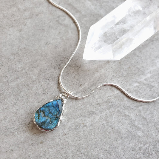 Blue Labradorite teardrop pendant necklace on tile