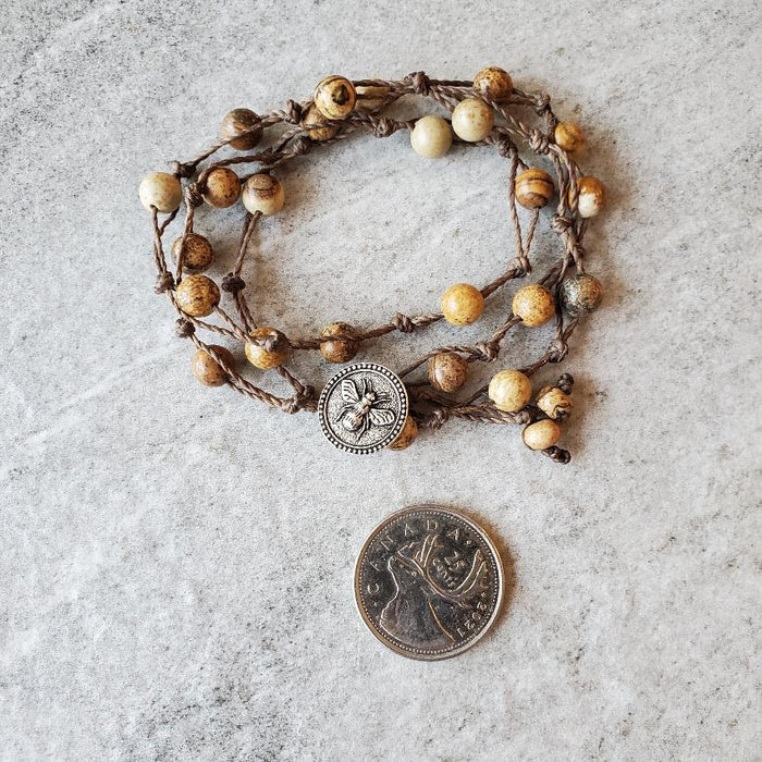 picture jasper wrap bracelet beside a quarter