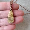 picture jasper teardrop pendant copper necklace in hand