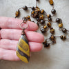 Tiger Eye long knotted necklace in hand