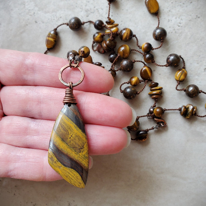 Tiger Eye long knotted necklace in hand