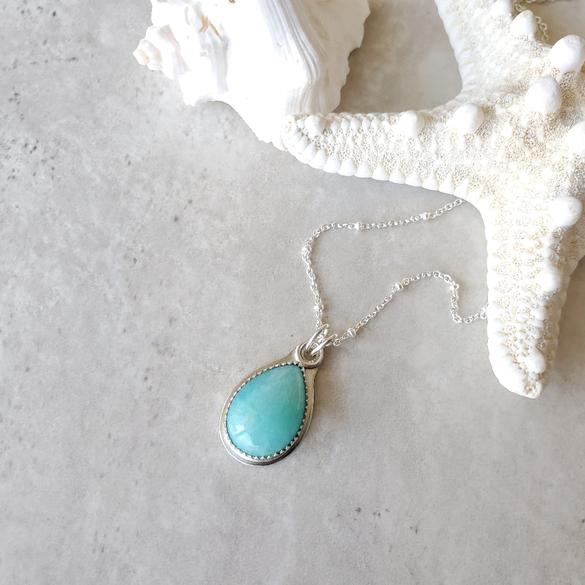 Amazonite teardrop silversmith necklace on tile