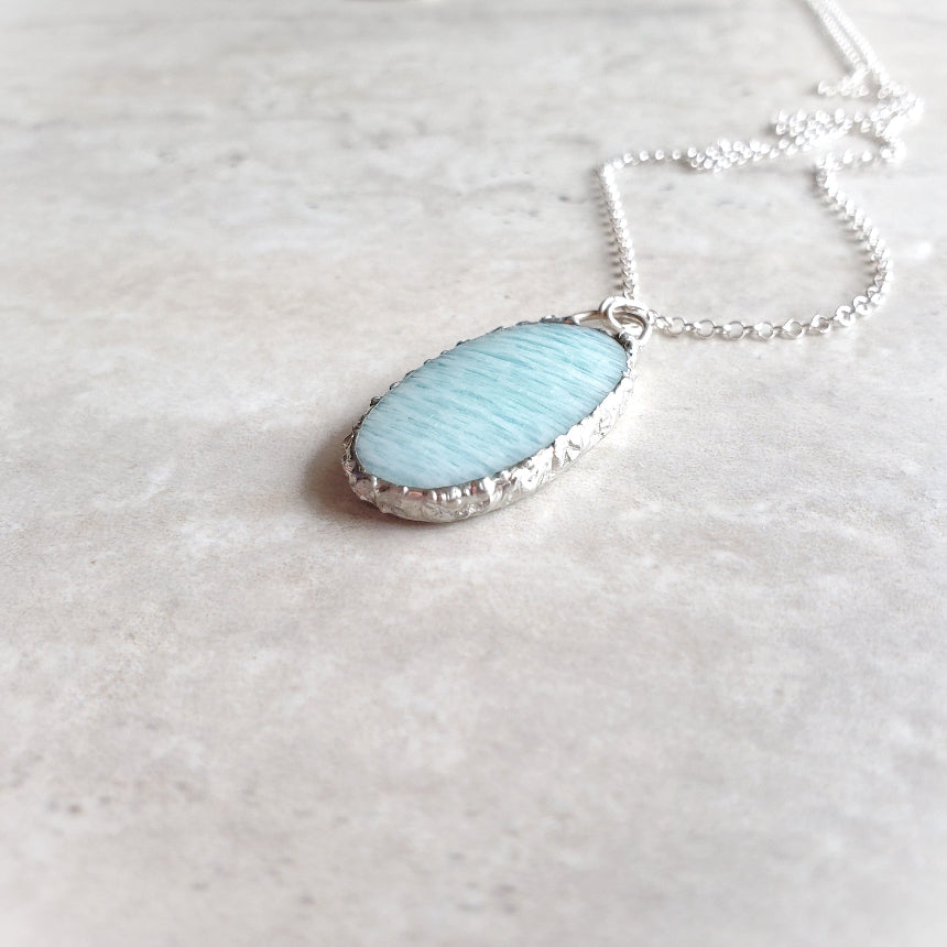 Amazonite oval pendant on tile