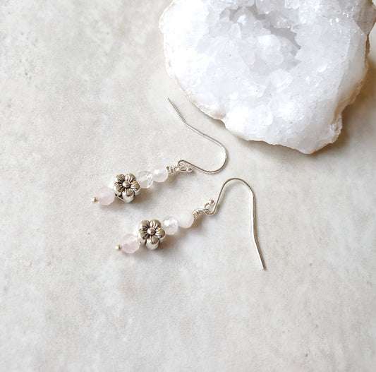 Faceted Rose Quartz earrings with flower accent on tile