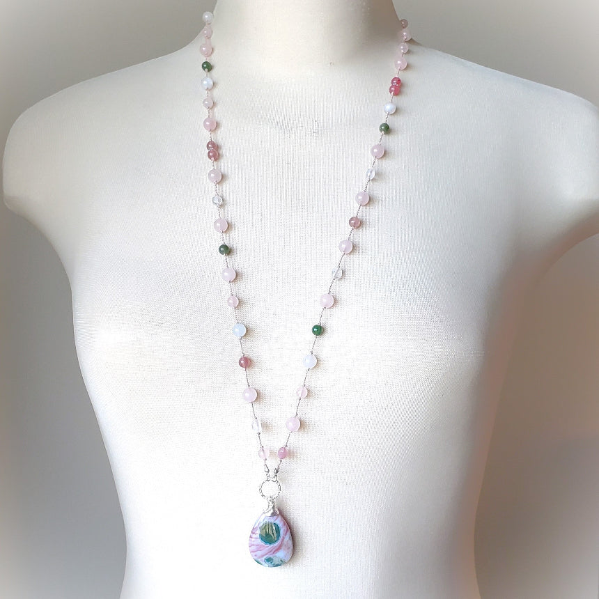 Pink and green gemstone knotted necklace on bust 
