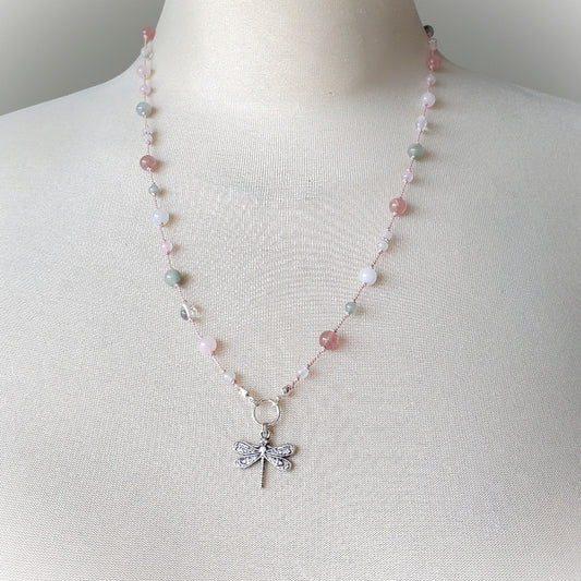 Knotted gemstone necklace with dragonfly focal on a bust