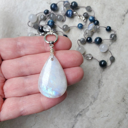 Hand knotted silk necklace with Moonstone, Blue Kyanite and Labradorite  in hand