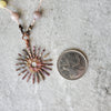 multi gemstone necklace with fire Painted copper sun focal beside a quarter