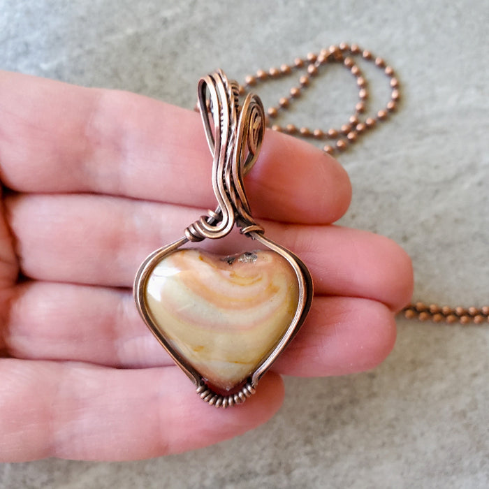 Polychrome Jasper wire wrap pendant necklace in hand