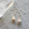 Crazy lace Agate herringbone wrap sterling silver earrings on tile 