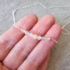 Multi gemstone bar sterling silver necklace in hand