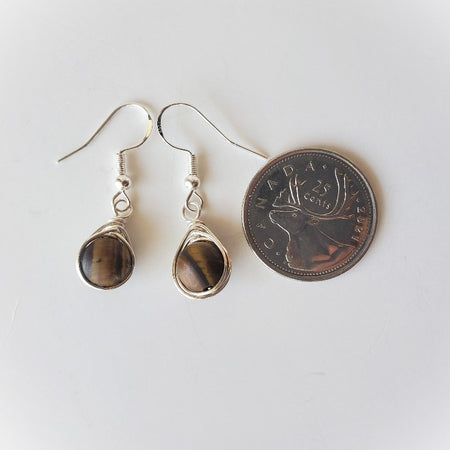 Tigers Eye herringbone wrap earrings beside a quarter