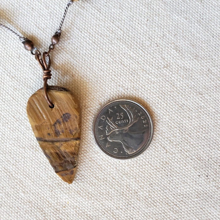 Tigers eye & picture jasper knotted necklace beside a quarter