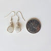 Frosted Smoky Quartz herringbone wrapped earrings beside a quarter