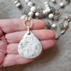 Howlite long knotted necklace in hand