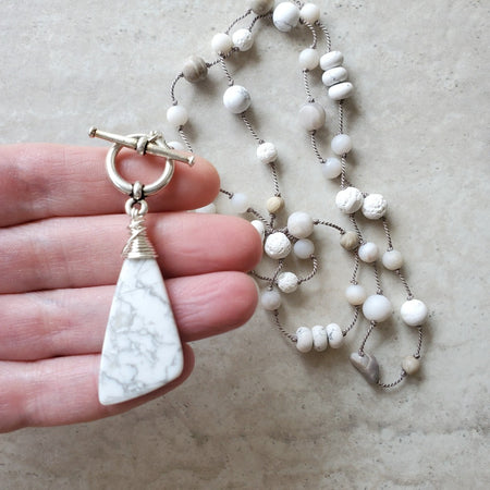Howlite long knotted necklace in hand