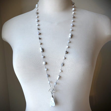 Multi bead knotted necklace on bust