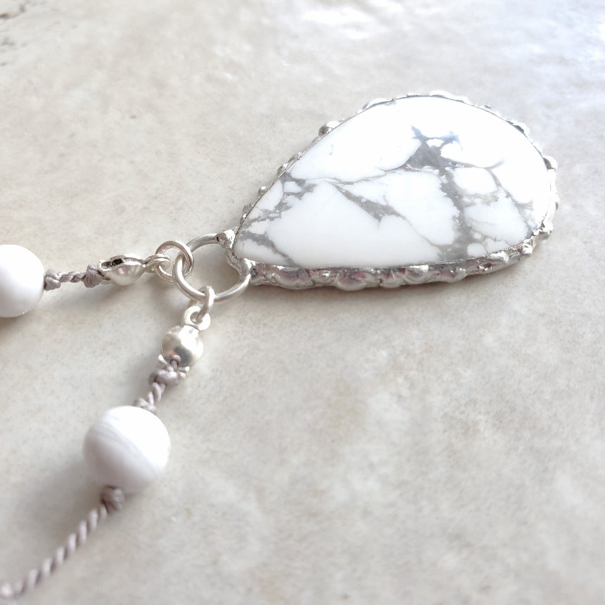 Howlite hand knotted necklace on tile