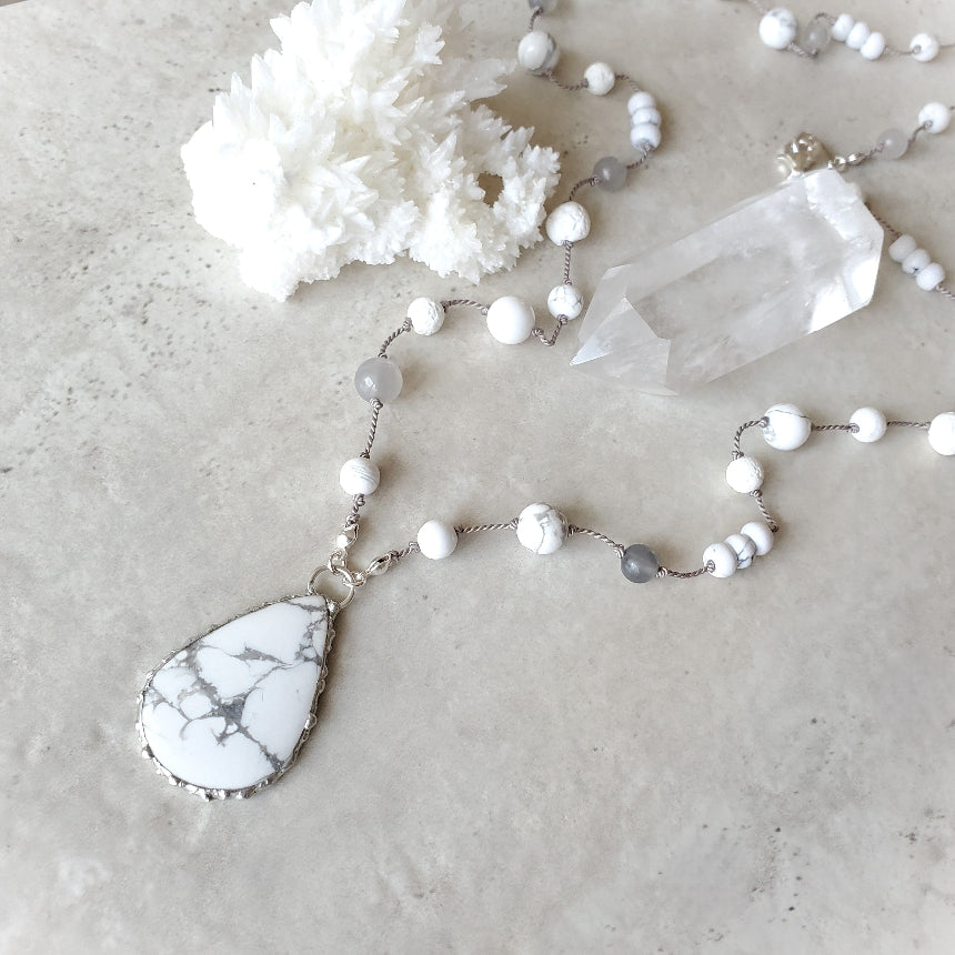 Howlite hand knotted necklace on tile
