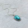 Tibetan Turquoise freeform Silversmith necklace on tile