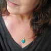 Tibetan Turquoise freeform Silversmith necklace on model