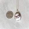 Wild Horse magnesite oval silversmith pendant