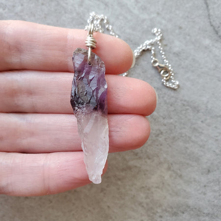 Chevron Amethyst point pendant necklace  in hand