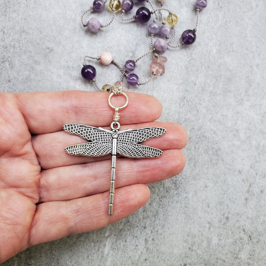 Multi gemstone silk knotted necklace with dragonfly focal in hand