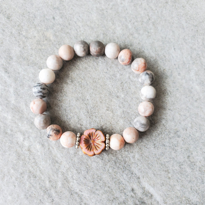 Pink Zebra Jasper bracelet with silver plated accent beads and a Czech glass flower bead. 