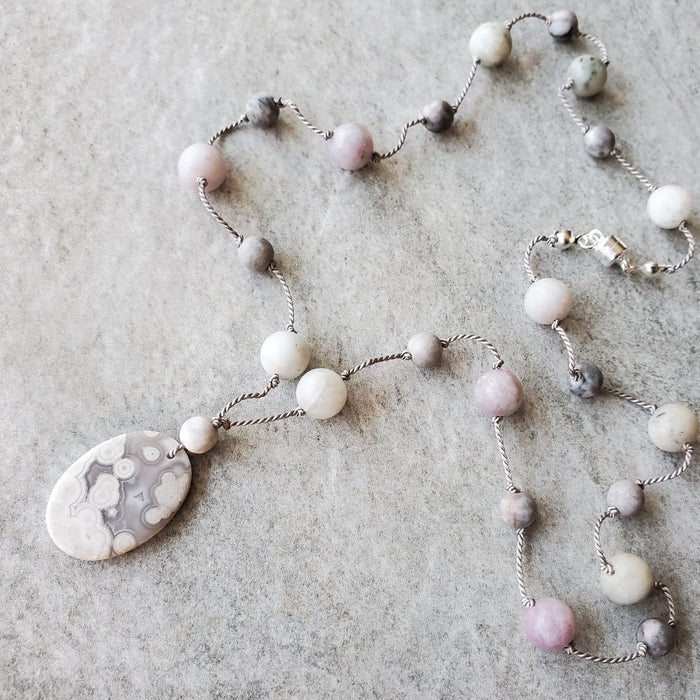 Hand knotted silk necklace featuring a purple lace agate focal  stone and beads
