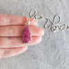 Silversmith pendant featuring a ruby zoisite gemstone and sterling silver setting. 