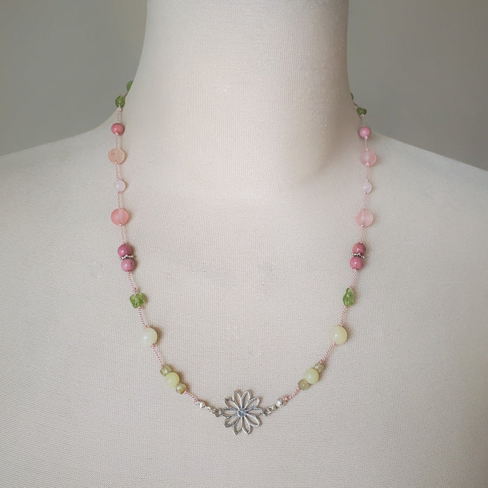 Colourful silk knotted necklace with multi gemstones and a flower connector. 