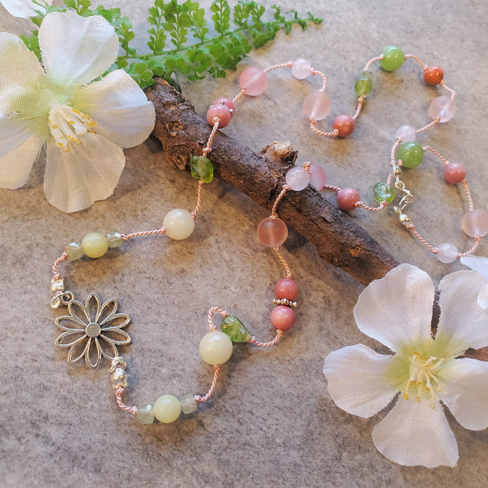 Colourful silk knotted necklace with multi gemstones and a flower connector. 