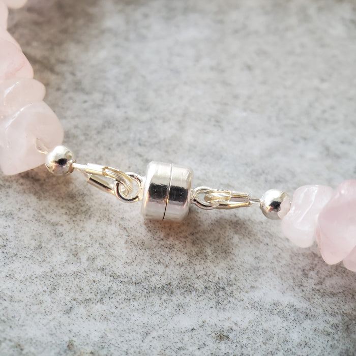 Spring Bracelet of Rose Quartz chips featuring a sterling silver dragonfly charm and peridot nuggets.