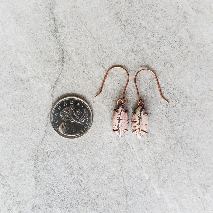 Sonora Dendrite stones prong set in copper wire.