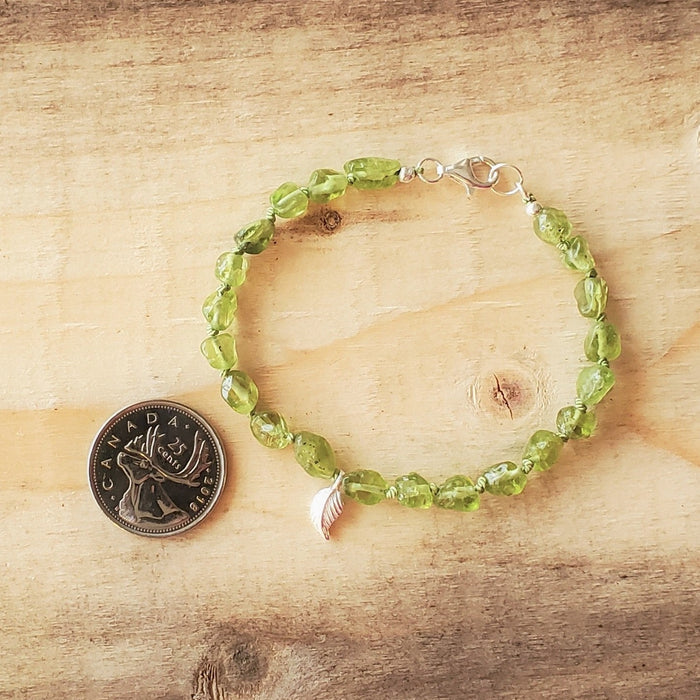 Hand knotted Peridot nugget bracelet with sterling silver leaf charm