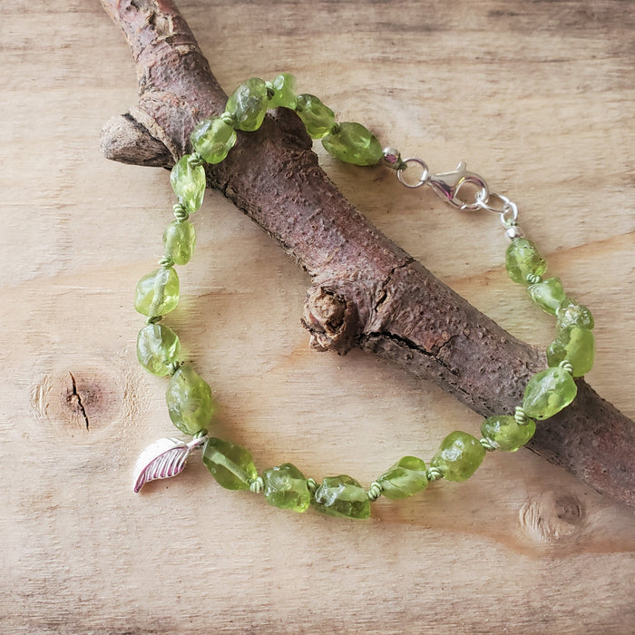 Hand knotted Peridot nugget bracelet with sterling silver leaf charm