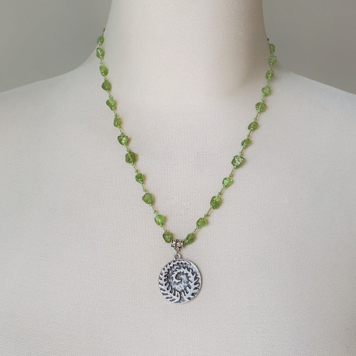 Peridot gemstone necklace on bust