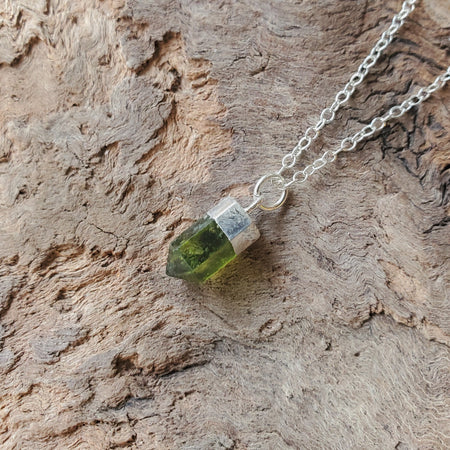 Peridot point pendant on sterling silver cable chain